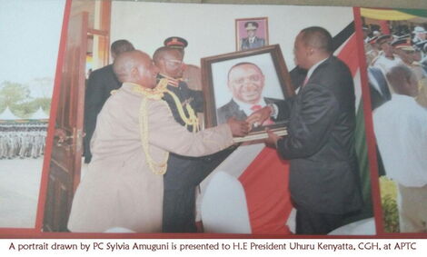 A potrait photo done by police constable Sylvia Kavere being presented to President Uhuru Kenyatta