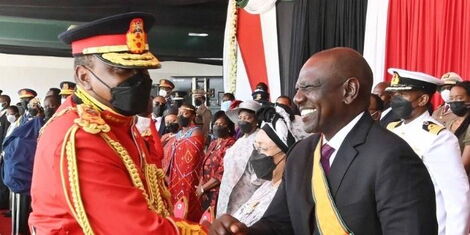 President Uhuru Kenyatta (left) greets his deputy William Ruto (right) during Jamhuri Day celebrations at Uhuru Gardens, Nairobi on Sunday December 12, 2021