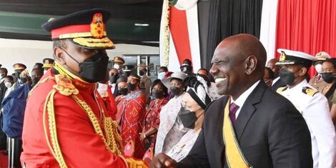 President Uhuru Kenyatta (left) greets his deputy William Ruto (right) during the Jamhuri Day celebrations at Uhuru Gardens, Nairobi on Sunday, December 12, 2021