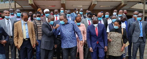 President Uhuru Kenyatta greets National Assembly Majority leader Amos Kimunya at KICC after Jubilee Parliamentary Group meeting on Monday, June 22, 2020