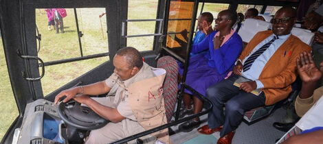Former President Uhuru Kenyatta drives a 53-seater bus he donated to Partakilat Primary school on Saturday, October 15, in Narok.