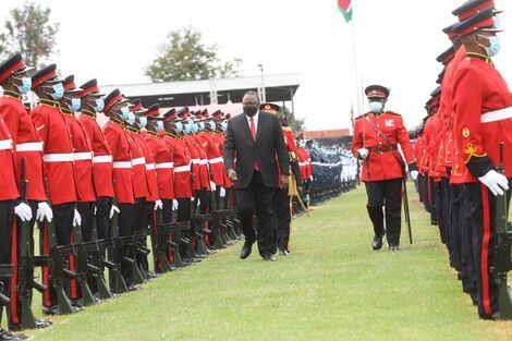 President Uhuru Kenyatta inspects a guard of honour at Wang'uru Stadium in Kirinyaga County during Madaraka Day celebrations on October 20, 2021. 