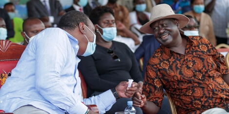 President Uhuru Kenyatta shares a light moment with ODM leader Raila Odinga at the Jaramogi Oginga Odinga Stadium on October 22, 2020.