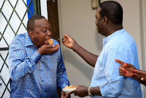 ODM leader Raila Odinga shares his birthday cake with President Uhuru Kenyatta at his home in Mombasa on January 7, 2019