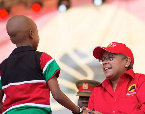 Ryan Mwenda pictured with First Lady Margaret Kenyatta at a Jubilee Party event in September 2016