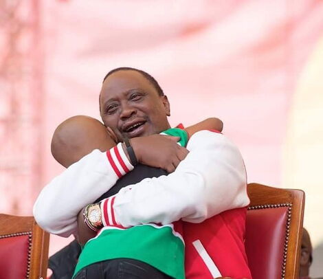 President Uhuru Kenyatta kisses Ryan Mwenda after the young artist performed at a jubilee party in September 2016