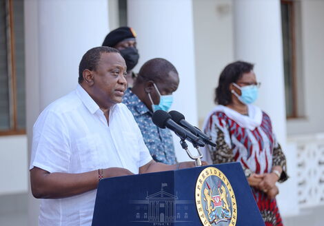 President Uhuru Kenyatta reading the review of containment measures of the virus on August 18, 2021.