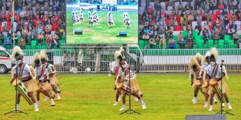 Dancing troupes entertain President Uhuru Kenyatta, First Lady Margaret Kenyatta, and dignitaries at Wang'uru Stadium in Kirinyaga during Mashujaa Day celebrations on October 20, 2021.