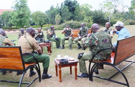 Deputy President William Ruto shares tea with his new security detail at his official residence in Karen.