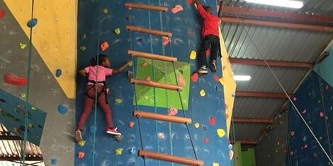 Andated image of children rock climbing at Diamond Plaza in Nairobi.