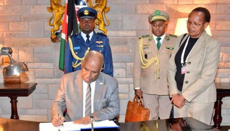 President of Comoros, Azali Assoumani signing official documents after arriving in Kenya on Tuesday, September 13, 2022