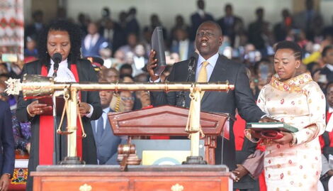 William Ruto taking the oath of office with his wife Rachel Ruto (right) at Kasarani on September 13, 2022