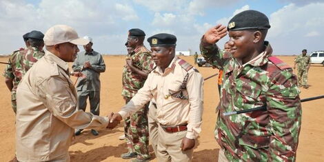 Interior Cabinet Secretary Kindiki Kithure (left) received by administrative officers in Wajir West on November 24, 2022. 