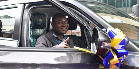 Francis Natembeya in his brand new car