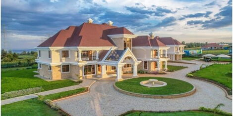 An image of the manicured and trimmed lawns and mansion in Ngata, Nakuru County.