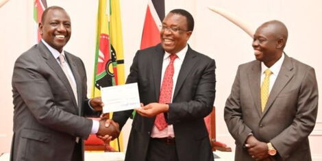 President William Ruto receives donation to the Hunger Response Appeal from the Group MD&CEO Co-op Bank Dr Gideon Muriuki (centre) at State House Friday 2 December 2022 as Deputy President Rigathi Gachagua looks on.