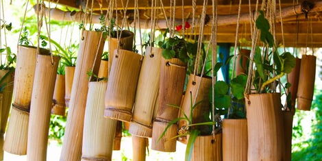 An image of bamboo carvings used as flower pots in decoration