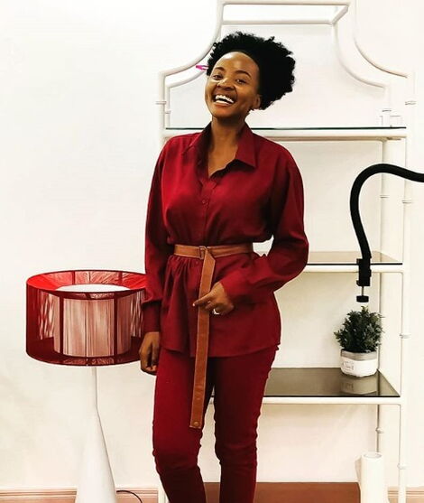 Valentine Nekesa rocks a red jumpsuit during a photoshoot in February 2020.