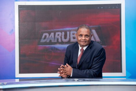 Veteran news anchor Badi Muhsin sitting in the refurbished KBC studio