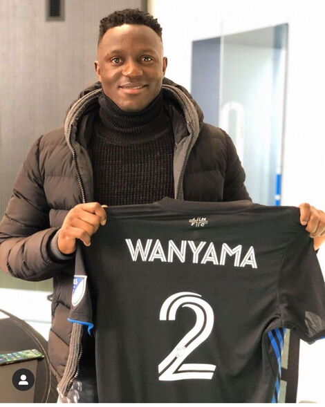 Victor Wanyama poses for a photo with a Montreal Impact shirt