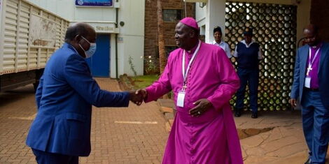 IEBC Chairperson Wafula Chebukati greeting Archbishop Jackson ole Sapit at the Anglican Church of Kenya Bishops and Senior Clergy conference on April 19, 2022.