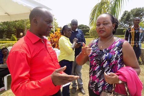 Kirinyaga Governor Anne Waiguru (right) speaks to her deputy Peter Ndambiri.