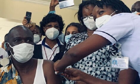 Health Acting Director General Dr Patrick Amoth receives the Covid-19 vaccine on Friday, March 5