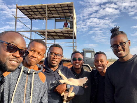 Ian Wafula with friends during the construction of the Truck House in Machakos.