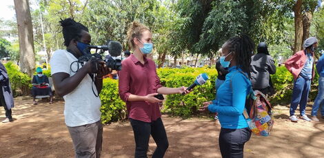 DW journalist Mariel Muller conducting an interview during protests in Nairobi on Saturday, May 1