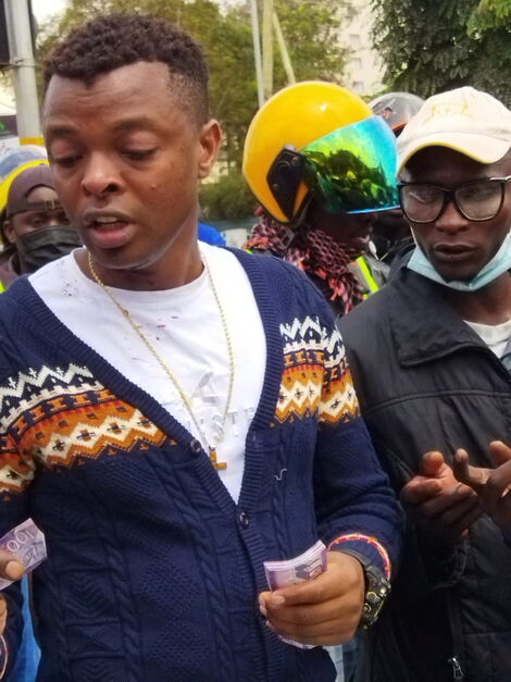 Singer Ringtone awarding boda boda rider who saved him from Robert Alai on Friday, July 23