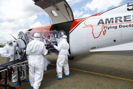 A file image of Amref Flying Doctor's medical staff loading a critically ill patient into an air ambulance. 