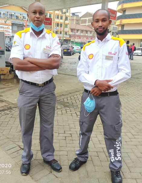 Vivo Energy Quality Marshall Balozi Chege (right) with a colleague during a site visit in 2020.