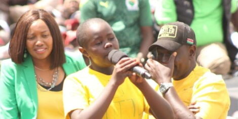 Nakuru Senator Susan Kihika watches as Deputy President William Ruto wipes off tears during a poem by Doreen Cheptoo in Kuresoi South on Friday, February 11, 2022.