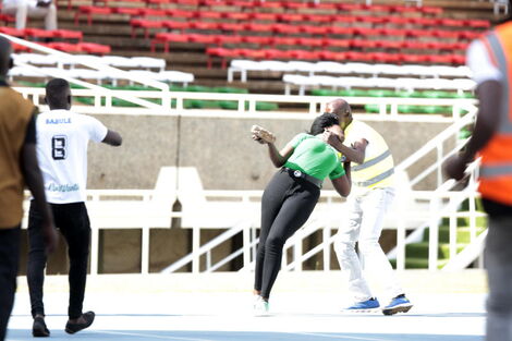 Winnie Nyar Kasagam was running with a brick at hand during a Gor Mahia game on February 13, 2022.