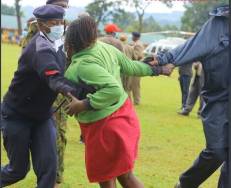 Woman Who Breached Security Being Handled by a Female Officer.