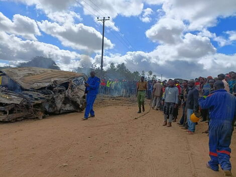 Police at the scene of the accident where 6 passengers died after a road crash along the Thika-Garissa highway in Machakos on Friday, July 15, 2022.