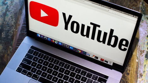 YouTube logo displayed on a laptop screen