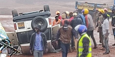 Witnesses at the scene of an accident near Kambiti at the Mango market area on Thursday, July 8.