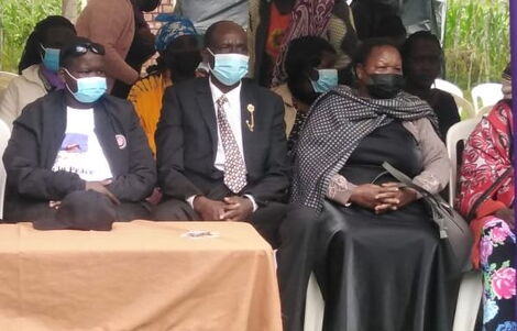 Caroline Kangogo’s parents at their daughter’s burial in Elgeyo Marakwet County.