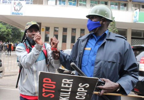 A protestor being arrested by a police officer on July 7, 2020.
