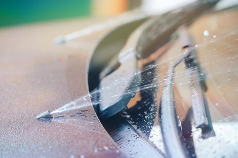 An image of a windscreen water being discharged.