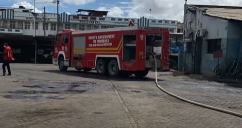 Fire fighters responding to a fire that razed down a section of Modern Coast yard next to Makupa Police Station in Mombasa on April 17, 2021.