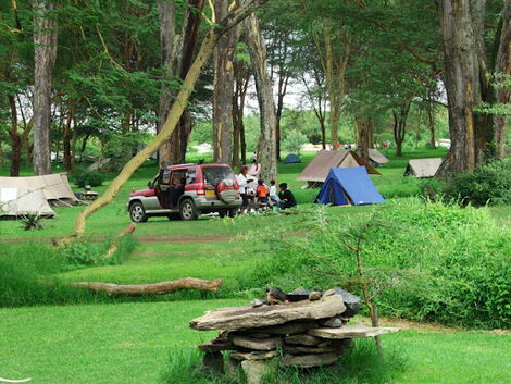 Image of individuals at a camp site dated setember 22