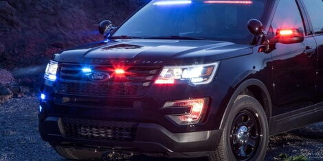 An image of a vehicle with red and blue flashing lights.