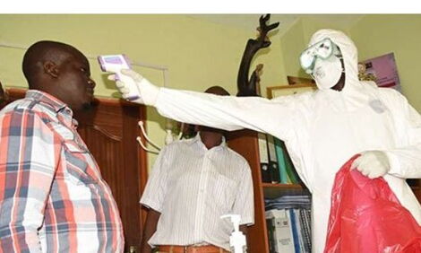 A health officer screening visitors at Nakuru County's health offices on February 19, 2020.