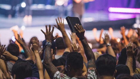 A stock photo of a church congregation worshiping