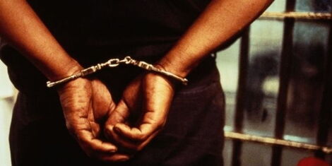 A picture of a man in handcuffs