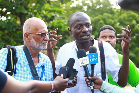 National media group Journalists Karim Rajan (left) and Laban Walloga (right) address the press after being released from Bamburi Police Station