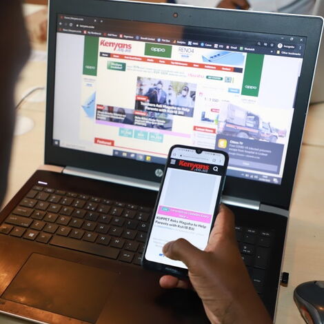 An image of the Kenyans.co.ke website display on a laptop and a mobile phone.