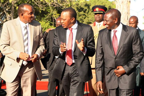 President Uhuru Kenyatta (centre) with Deputy President William Ruto (right) and Majority Leader Aden Duale at Jomo Kenyatta International Airport on January 29, 2014.
